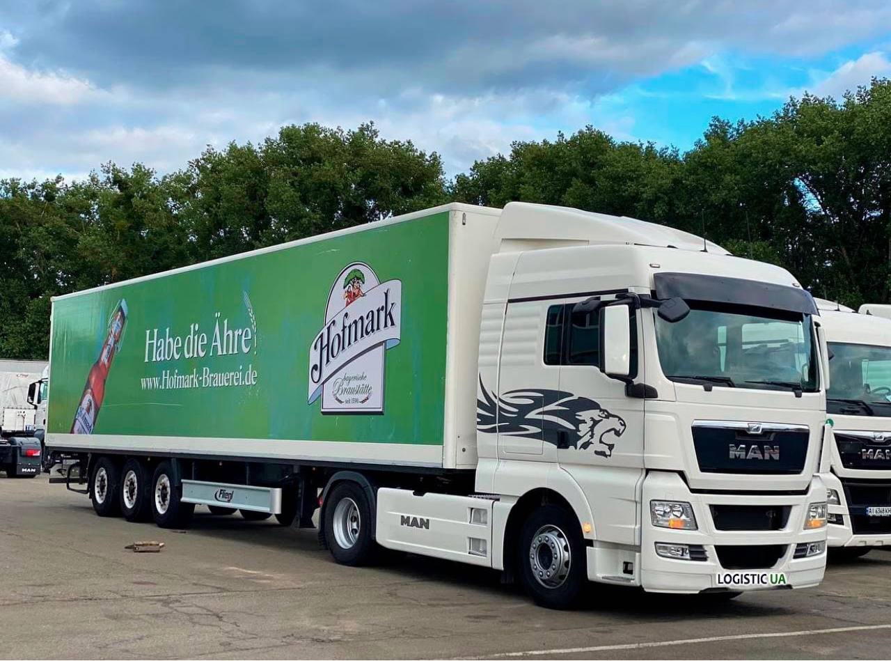LOGISTIC UA white MAN truck with isothermal trailer